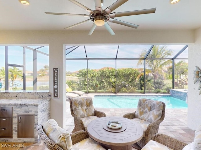 view of swimming pool featuring ceiling fan