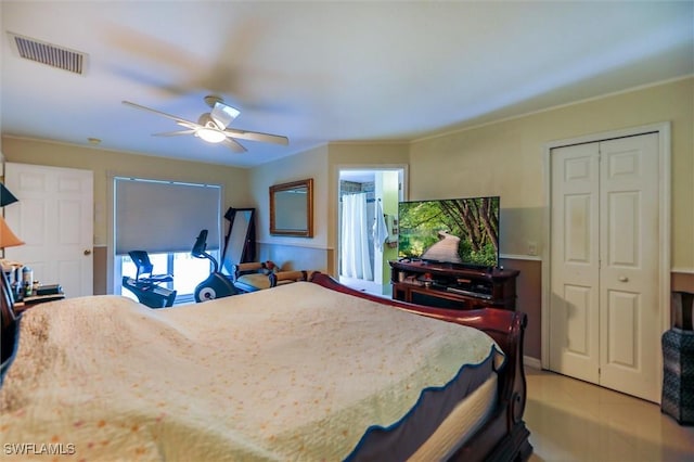 bedroom with ceiling fan and light tile patterned floors