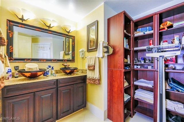 bathroom with tile patterned floors and vanity