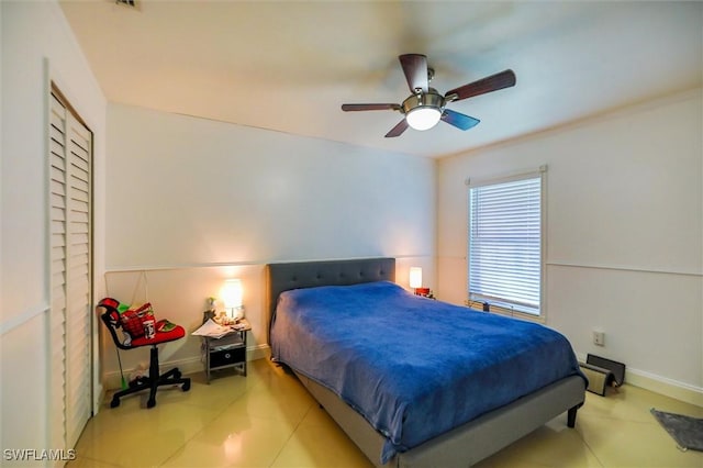 bedroom with light tile patterned floors and ceiling fan