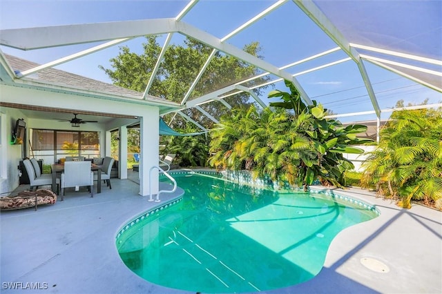 view of pool featuring a lanai, a patio area, and ceiling fan