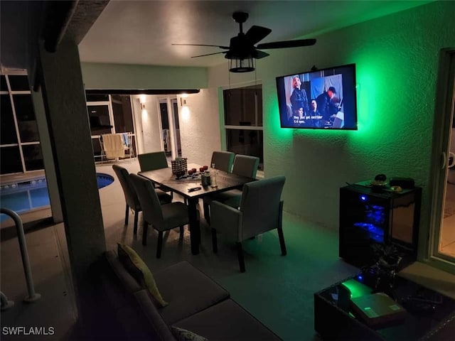 dining area featuring ceiling fan and carpet floors