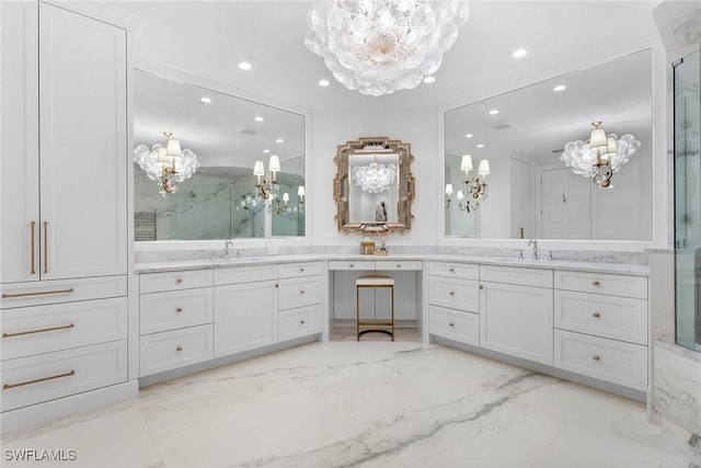 bathroom with a notable chandelier, an enclosed shower, and vanity