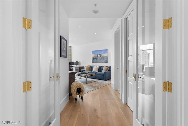 corridor featuring light hardwood / wood-style floors