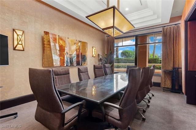 dining room featuring carpet floors and crown molding