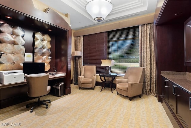 office area featuring a tray ceiling and crown molding