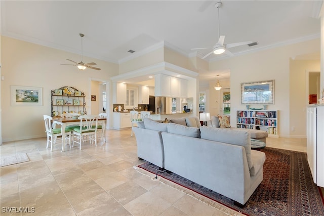 living room featuring crown molding and ceiling fan