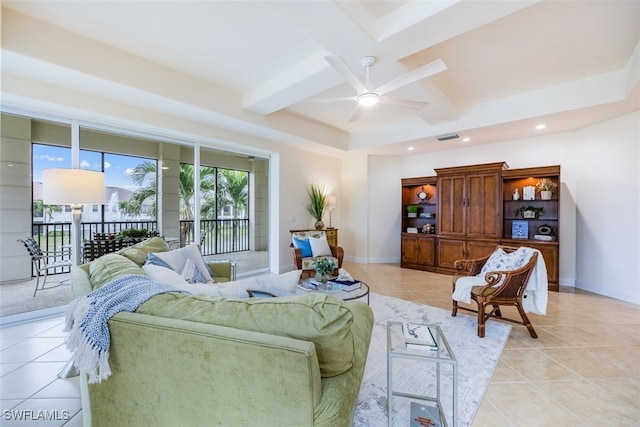 tiled living room with coffered ceiling, ceiling fan, and beamed ceiling