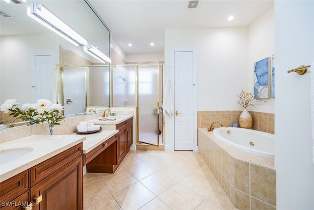 bathroom with tile patterned flooring, separate shower and tub, and vanity