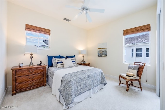 carpeted bedroom with ceiling fan