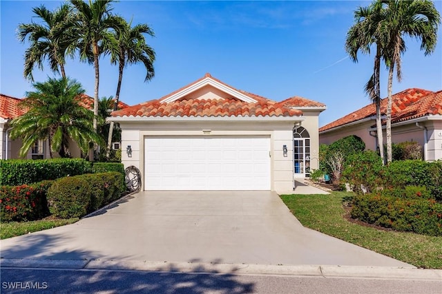 mediterranean / spanish-style home featuring a garage