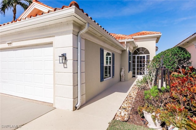 view of property exterior with a garage