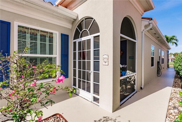 doorway to property featuring a patio area