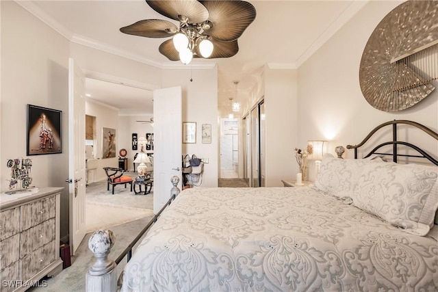 bedroom featuring carpet flooring, ceiling fan, and ornamental molding