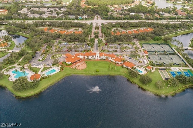 birds eye view of property with a water view