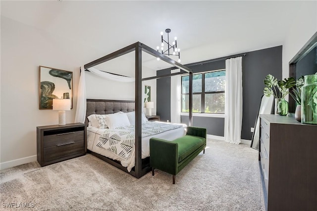 carpeted bedroom featuring a notable chandelier