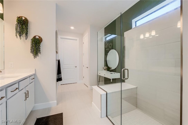 bathroom featuring tile patterned flooring, vanity, and an enclosed shower