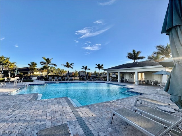 view of swimming pool featuring a patio