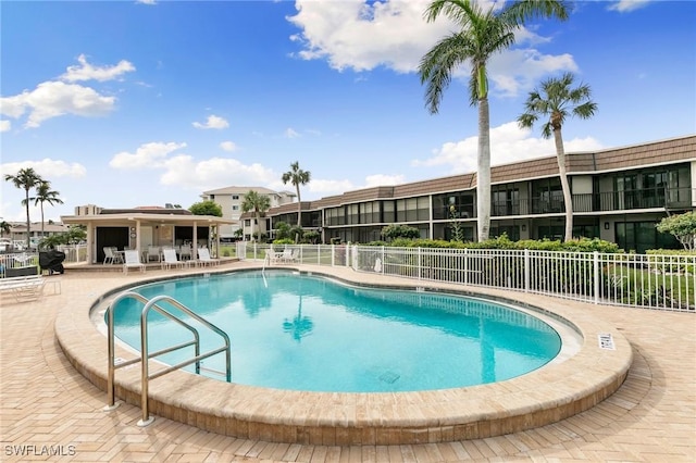 view of swimming pool with a patio