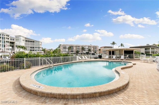 view of swimming pool featuring a patio