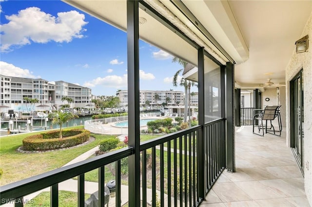 balcony featuring a water view