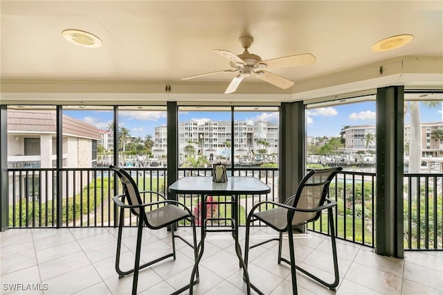 sunroom / solarium with ceiling fan