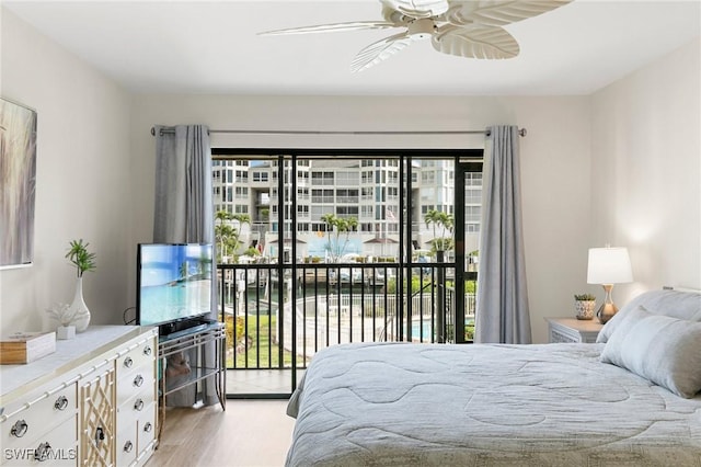 bedroom featuring ceiling fan, light wood-type flooring, and access to outside