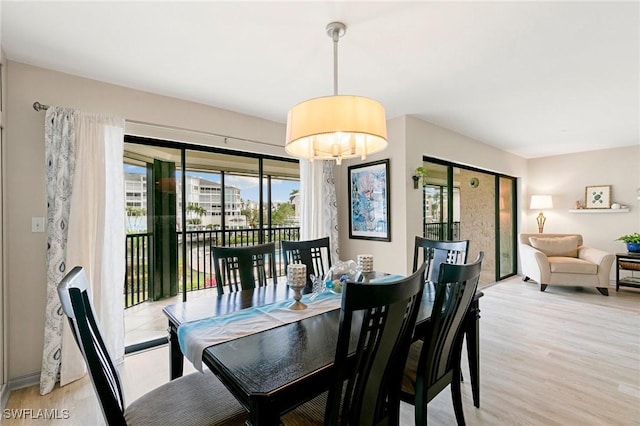 dining room with light wood-type flooring