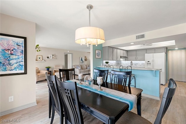 dining area featuring light hardwood / wood-style floors