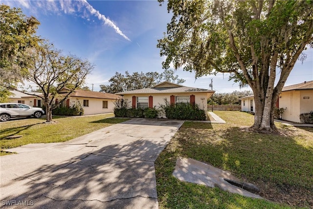 ranch-style house featuring a front lawn