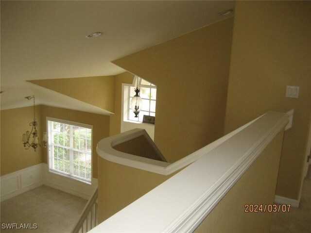 hallway featuring lofted ceiling