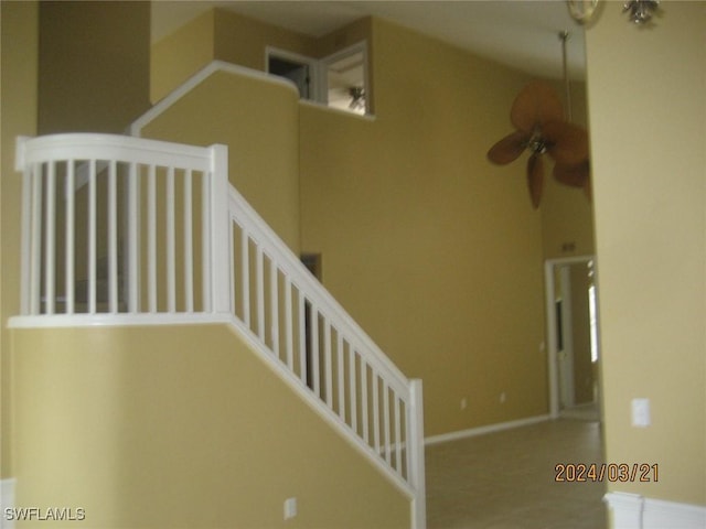 staircase with ceiling fan