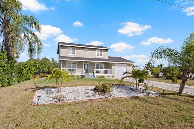 view of front of property featuring a porch, a garage, and a front lawn