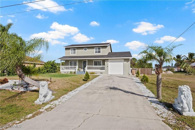 front of property featuring a garage, covered porch, and a front lawn