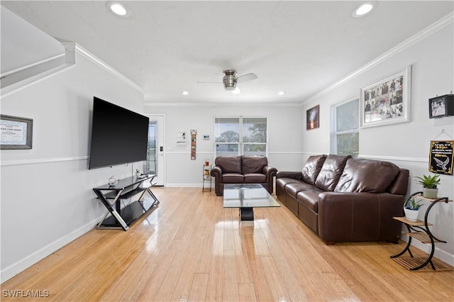 living room with ceiling fan, light hardwood / wood-style floors, and ornamental molding