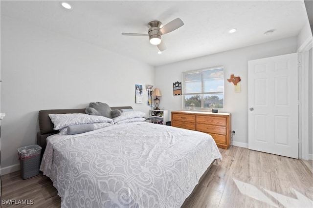 bedroom featuring ceiling fan and light hardwood / wood-style flooring