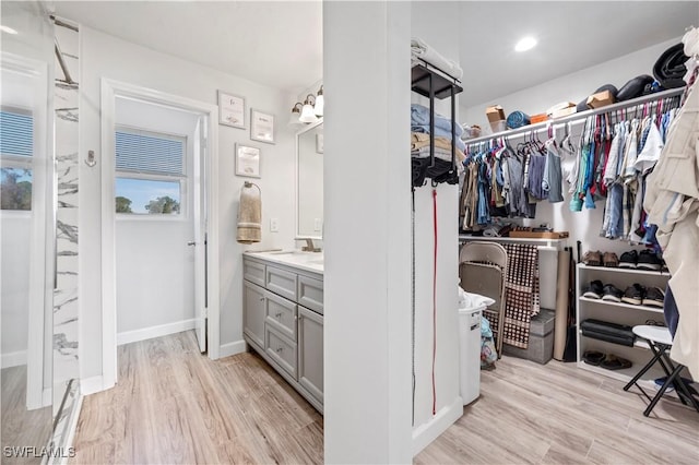 spacious closet with light wood-type flooring