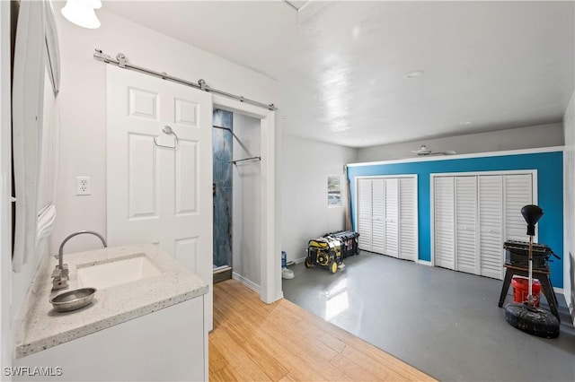 bathroom with vanity and concrete floors