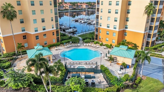 view of swimming pool featuring a water view