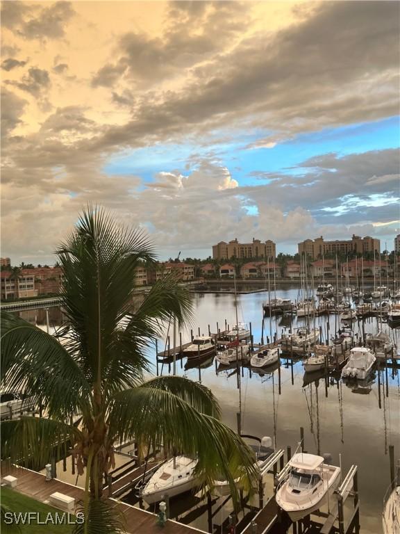 property view of water featuring a boat dock