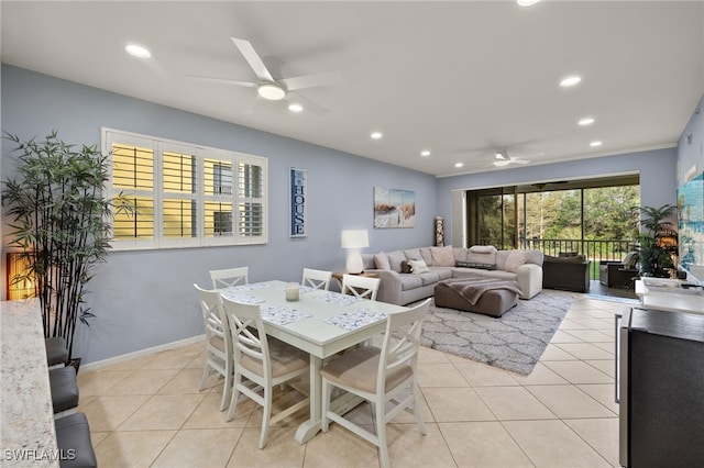 dining room with ceiling fan and light tile patterned flooring