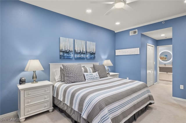 bedroom with crown molding, ceiling fan, a closet, and light carpet