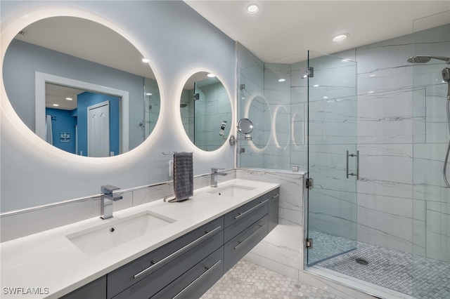 bathroom featuring tile patterned flooring, vanity, and walk in shower