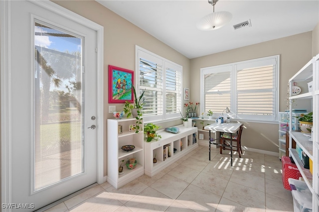 interior space with light tile patterned floors