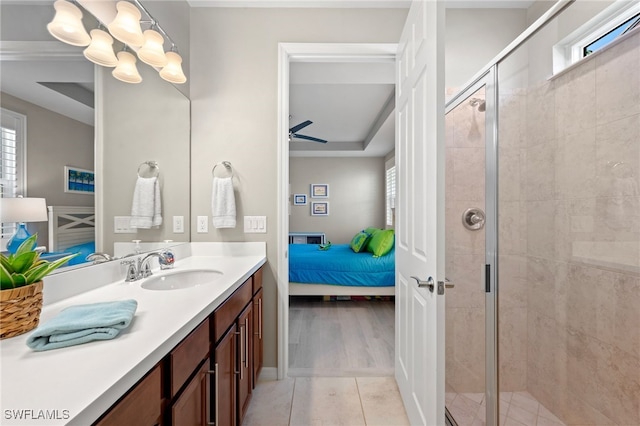 bathroom with tile patterned floors, a shower with door, and a wealth of natural light