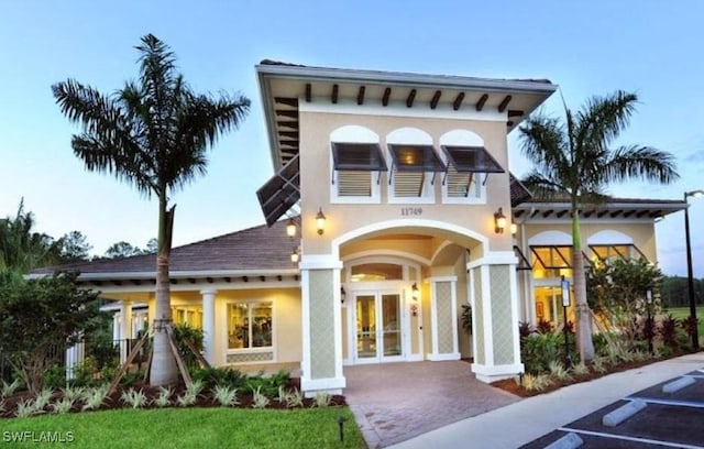 back of house featuring french doors