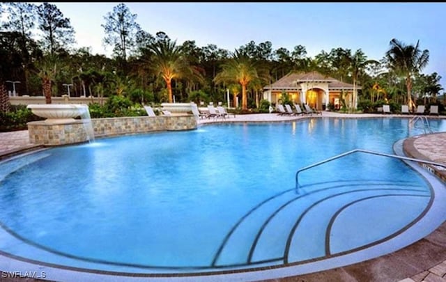 view of pool featuring pool water feature