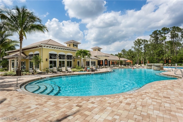 view of pool featuring a patio