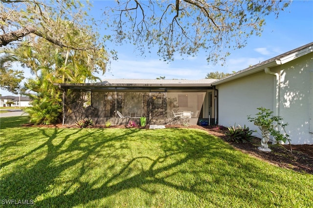 view of yard with a sunroom