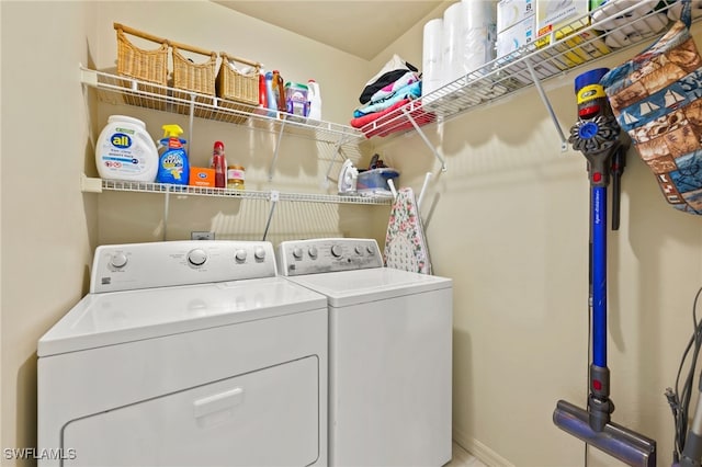 clothes washing area featuring washing machine and dryer